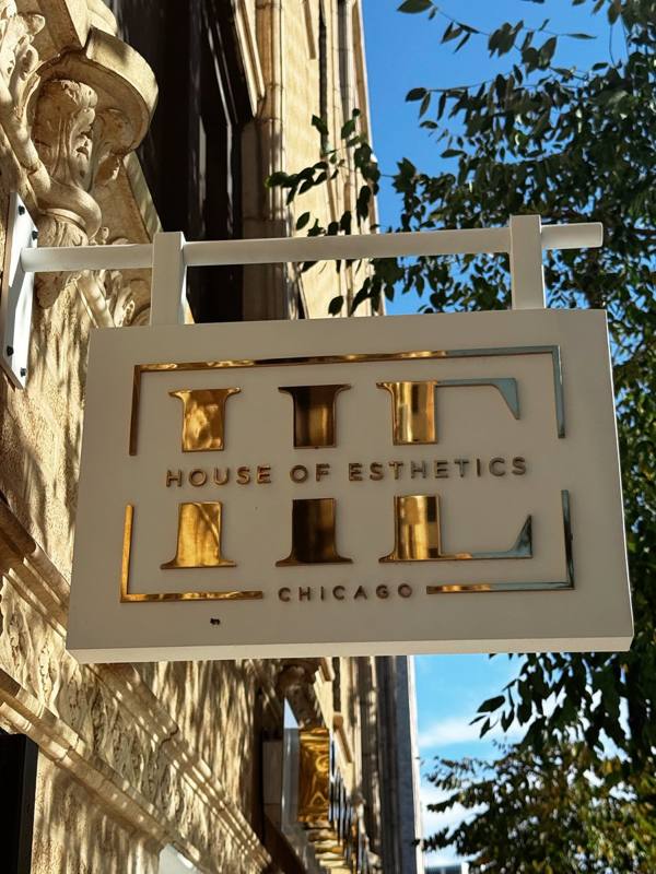 House of Esthetics Chicago storefront sign in golden light